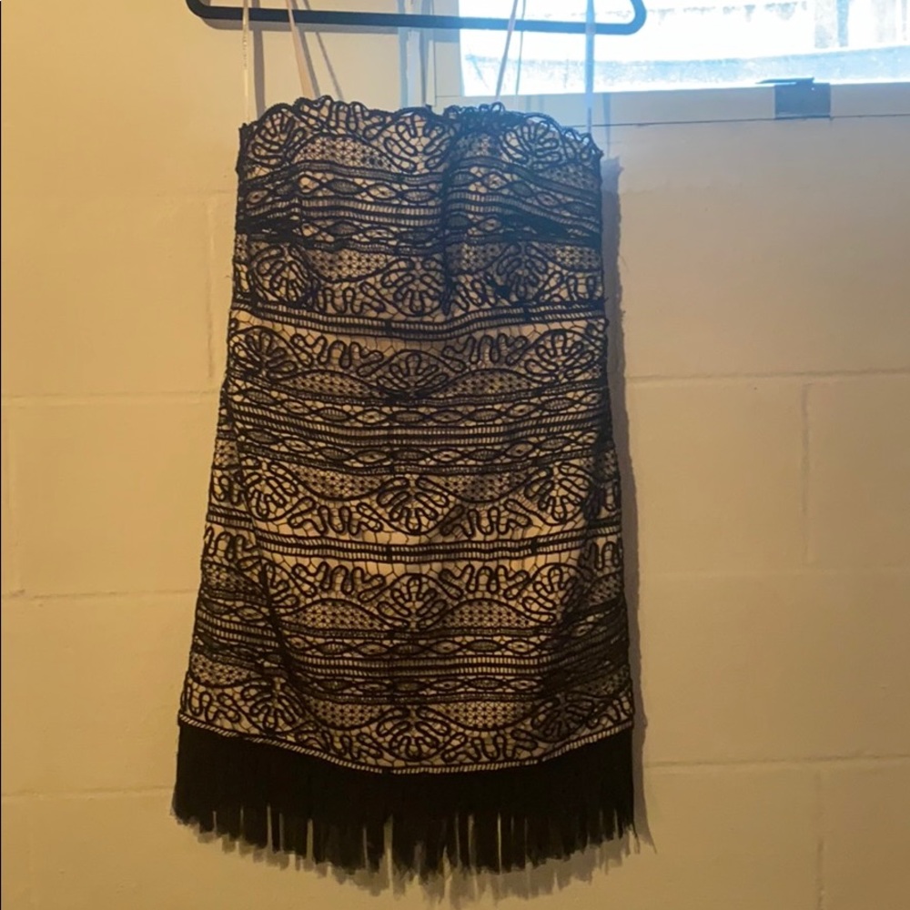 Black and nude lace dress with fringe details